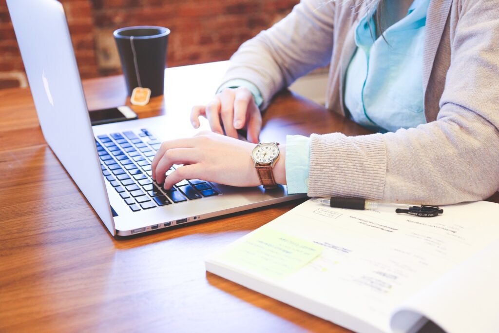 hands on a laptop keyboard